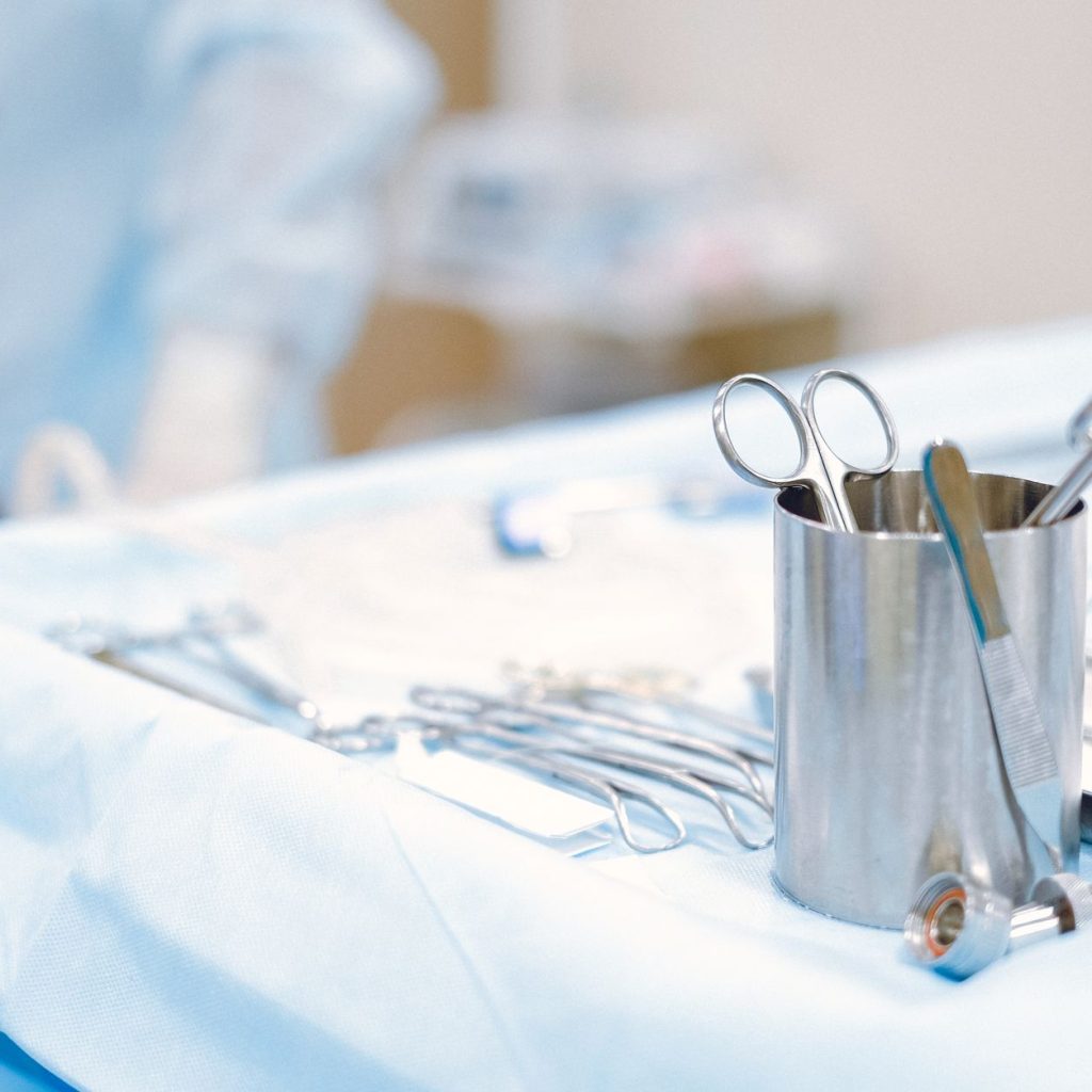 Surgical instruments arranged on a sterile table in an operating room