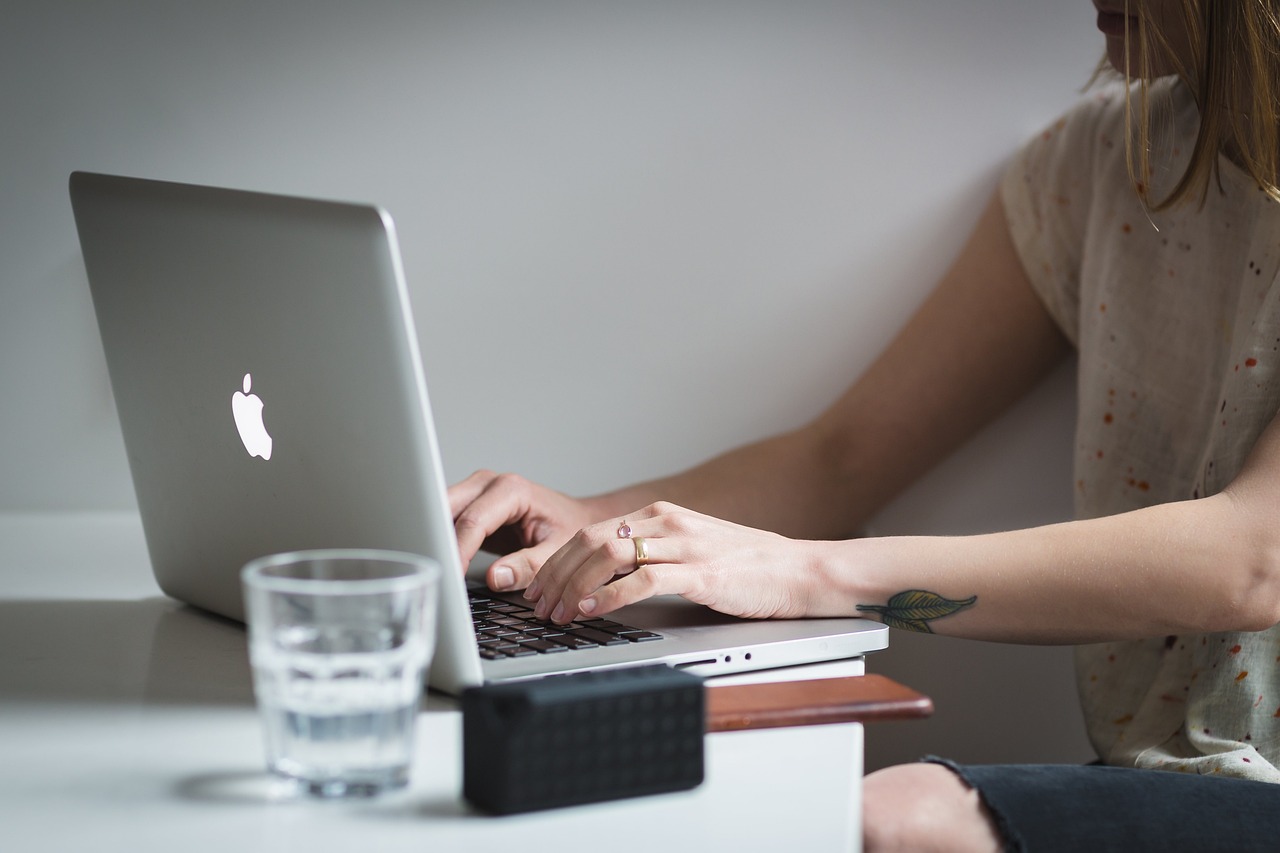 Laptop, apple, macbook — Ethnic Rhinoplasty for Every Face: Personalized Solutions in New York City