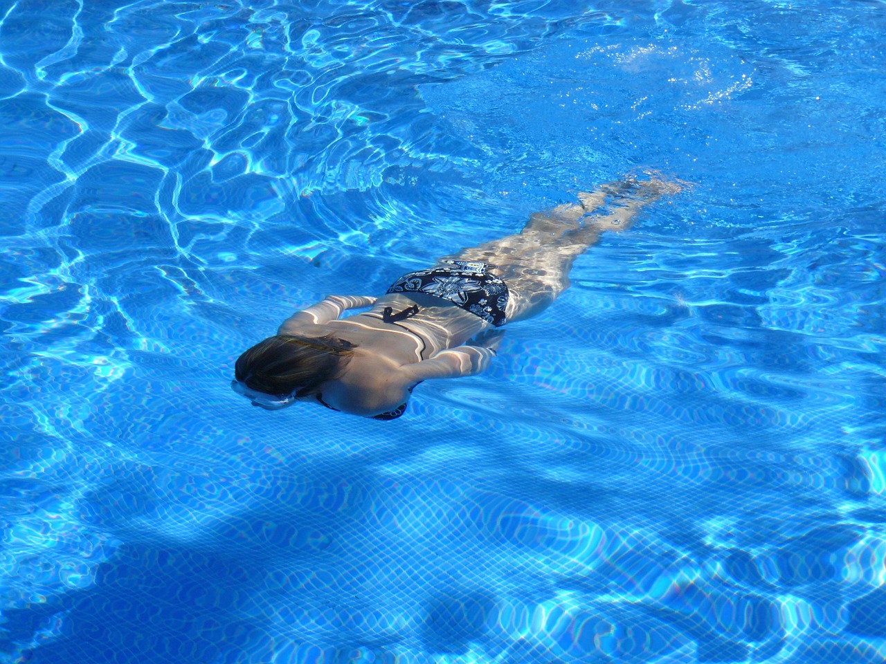 Woman, swim, nature — What causes blood in stool?